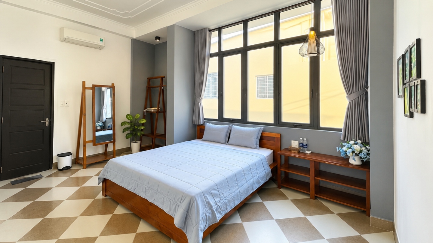 Slaapkamer met eenvoudige elegantie in Queenie House